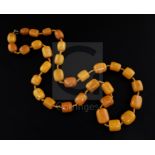 A single strand barrel shaped amber bead necklace, gross weight 131 grams, 86cm.