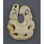 A rare Maori whale bone and paua shell pendant, hei tiki of unusual hei matau form, possibly late