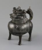 A Chinese bronze mythical beast censer and cover (Luduan), 17th century, the cover with pierced