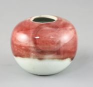 A Chinese copper red and white glazed globular water pot, 18th / 19th century, the mottled copper