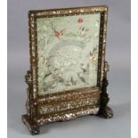 A Chinese embroidered silk, hongmu and mother of pearl framed table screen, c.1900, the