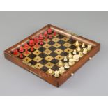 A Jaques & Son In Statu Quo mahogany and boxwood travelling chess set, with red stained and