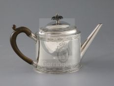 A George III silver oval teapot by Hester Bateman, with engraved crest and decorated with beaded and