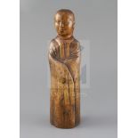 A Chinese wood figure of a sage or scholar, Qing dynasty, wearing long robes and with plaited
