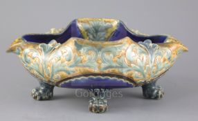 Frank A Butler for Doulton, a rare quatrefoil dish on four paw feet, dated 1882, impressed mark