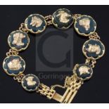 An early 20th century 9ct gold and bloodstone panel set bracelet, each stone mounted with a gold