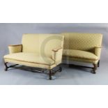 A Queen Anne upholstered scroll arm sofa and a matching reproduction sofa, with cabriole legs,