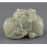 A Chinese pale celadon jade group of a boy on a recumbent elephant, 19th century, the boy clasping a