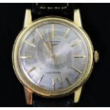 A gentleman's early 1960's 18ct gold Longines automatic wrist watch, with baton numerals, movement