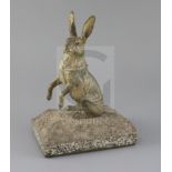 An early 20th century Austrian cold painted bronze inkwell, modelled as a seated hare, on