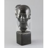 Nguyen Thanh Le (1919- Vietnam). A bronze head of a Vietnamese woman, signed, on black marble