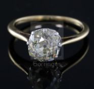 A gold and old mine cut solitaire diamond ring, the stone measuring approximately 8.5mm by 8.3mm,