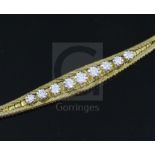 A mid 20th century Italian 18ct gold and graduated illusion set nine stone diamond set bracelet,