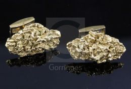 A pair of 1970's 18ct gold modernist cufflinks, of nugget form, cufflink head 29mm.