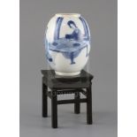 A Chinese blue and white small ovoid vase, Kangxi period, painted with two ladies seated at a