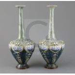 Eliza Simmance for Royal Doulton, a pair of Art Nouveau lily design bottle vases, c.1910, each ovoid