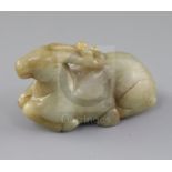 A Chinese pale celadon and russet jade figure of a recumbent stag, 19th century, L.8.7cm