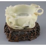 A Chinese pale celadon jade 'lotus' cup, late Ming dynasty, the cup formed as a lotus flower