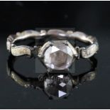 A George II gold, white enamel and rose cut diamond set mourning ring, with rock crystal panel en