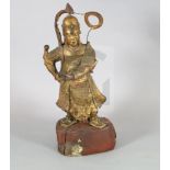 A large Chinese gilt-decorated and polychrome lacquer figure of a temple guardian, 19th century, the