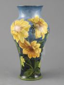 A Doulton Lambeth faience baluster vase, c. 1895, by Katharine B Smallfield, painted with sunflowers