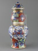 A large Chinese clobbered blue and white double gourd vase and cover, Kangxi period, painted with