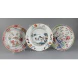 Three Chinese export famille rose dishes, Qianlong period, the first painted with a river landscape,