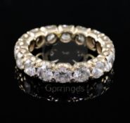 A gold and diamond full eternity ring, set with sixteen round cut diamonds, with a total approximate