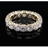 A gold and diamond full eternity ring, set with sixteen round cut diamonds, with a total approximate