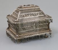 A 19th century Indian silver filigree casket, of rectangular form, on pierced scroll feet, plaque on