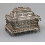 A 19th century Indian silver filigree casket, of rectangular form, on pierced scroll feet, plaque on