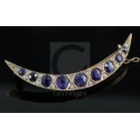 An Edwardian gold, graduated sapphire and rose cut diamond set crescent brooch, 5cm.