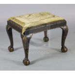 An early 18th century Irish walnut dressing stool, with drop in seat, scroll and gadroon carved