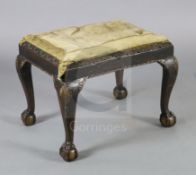 An early 18th century Irish walnut dressing stool, with drop in seat, scroll and gadroon carved