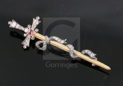 A late Victorian gold and silver, ruby, old and rose cut diamond set sword and ribbon bow brooch,