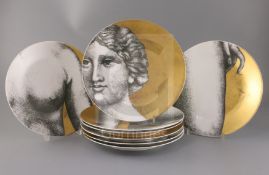 A group of eight Fornasetti plates, five in Eva pattern and three in Adamo, black printed marks to