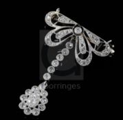 A 1920's pierced platinum? and millegrain set diamond drop brooch, set with old round and rose cut