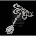 A 1920's pierced platinum? and millegrain set diamond drop brooch, set with old round and rose cut