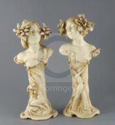 A pair of Ernst Wahliss Art Nouveau busts of ladies, c.1905, each lady with flowers in her hair, the