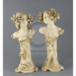 A pair of Ernst Wahliss Art Nouveau busts of ladies, c.1905, each lady with flowers in her hair, the
