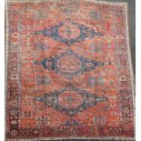 A Soumak red ground carpet, with octagons in a field of geometric motifs and four row border(