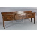 A George III oak dresser base, with planked top and four drawers, on squared tapered legs, W.7ft