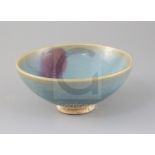 A Chinese Jun ware purple-splashed bowl, Song-Ming dynasty, with a crackle to the glaze all over and