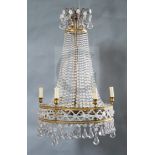 A French gilt metal and glass bag chandelier, hung with beaded and tier shaped drops, drop 3ft