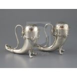 A pair of silver horn-shaped sugar casters with dolphin mask terminals, Birmingham 1929, Henry