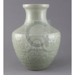 A Chinese celadon glazed archaistic moulded vase, Qianlong underglaze blue seal mark to base,