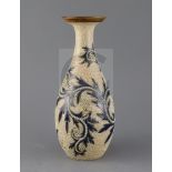 George Tinworth for Royal Doulton, a foliate and vermicular decorated bottle vase, c.1905, impressed