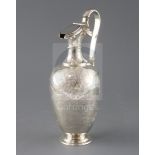 A late Victorian engraved silver hot water jug by Martin, Hall & Co, of vase form, with foliate