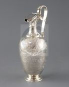 A late Victorian engraved silver hot water jug by Martin, Hall & Co, of vase form, with foliate