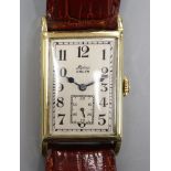 A gentleman's 1930's 14k Alpina Gruen manual wind wrist watch, with rectangular Arabic dial and